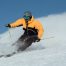 skier enjoying powder snow on a clear day