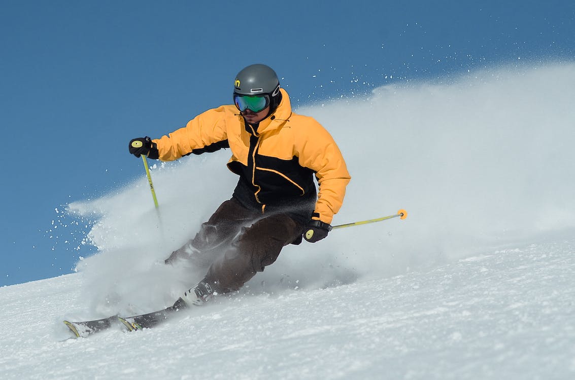 skier enjoying powder snow on a clear day