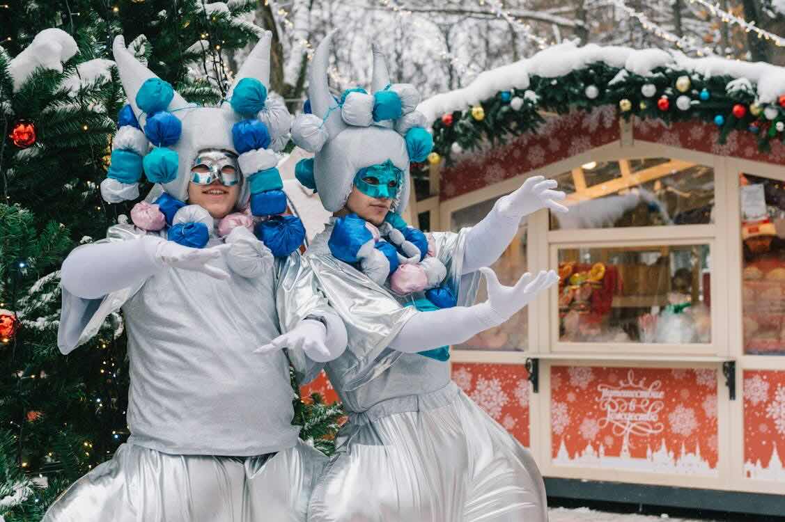 two people in costume during winter carnival two people in costume during winter carnival
